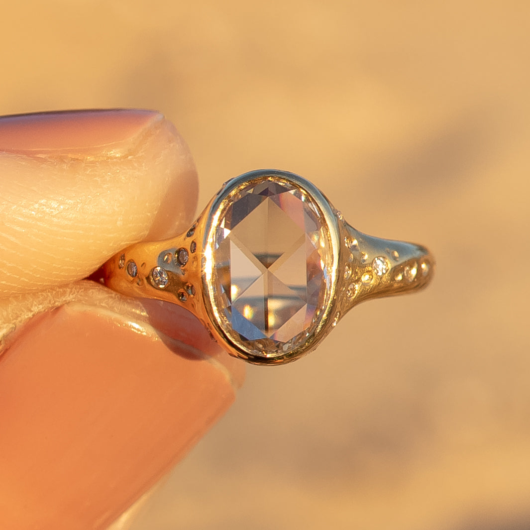 organic lava rock ring with oval rose cut diamond