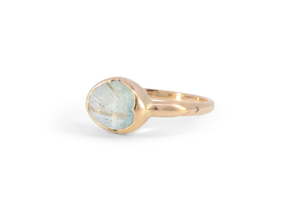 14k gold moss aquamarine ring with carved arrows and diamonds
