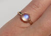 14k gold blue moonstone ring with carved arrow details on hand