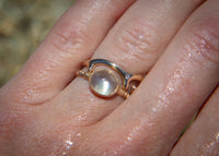 14k gold green moonstone ring on hand