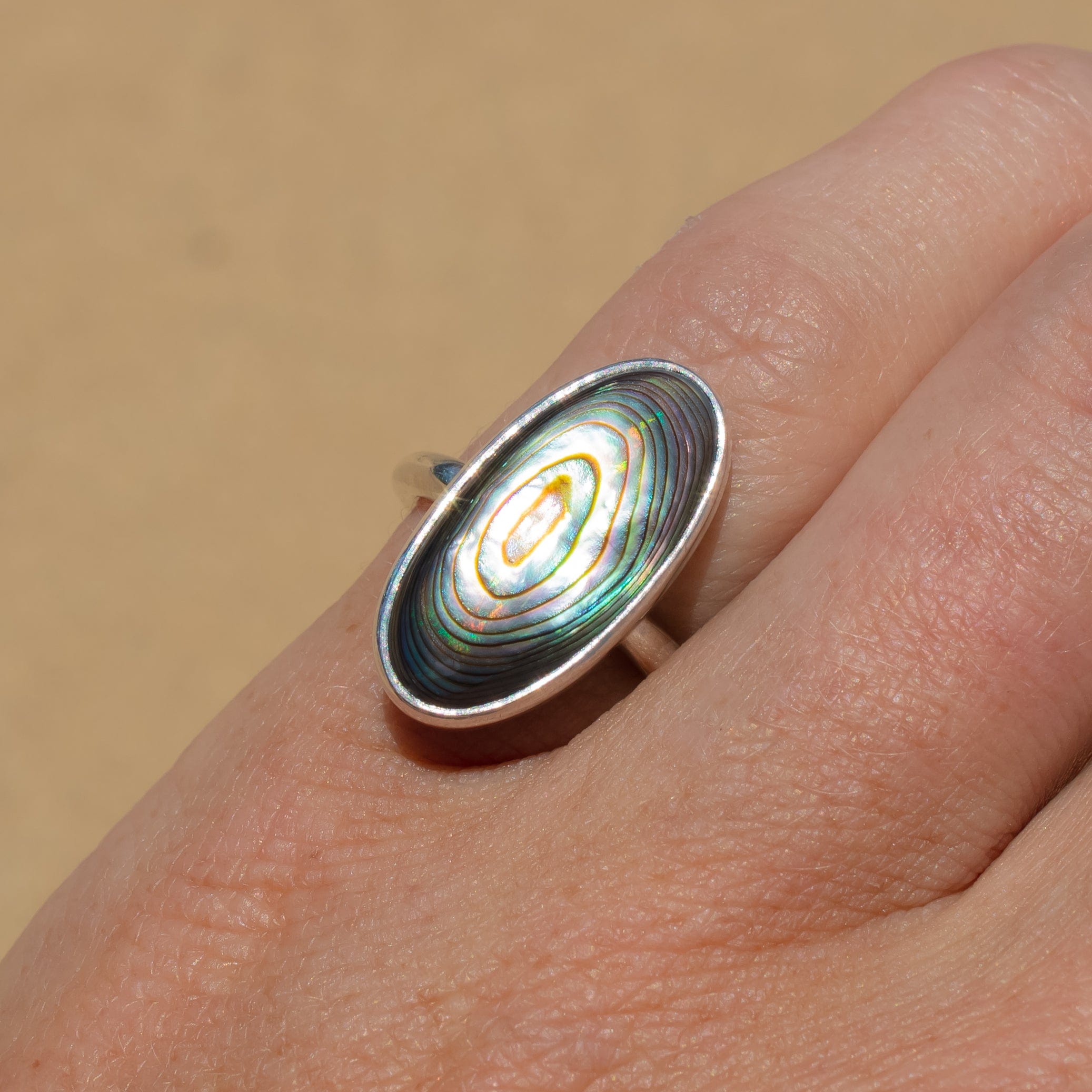 sterling silver elongated abalone shell ring  on hand