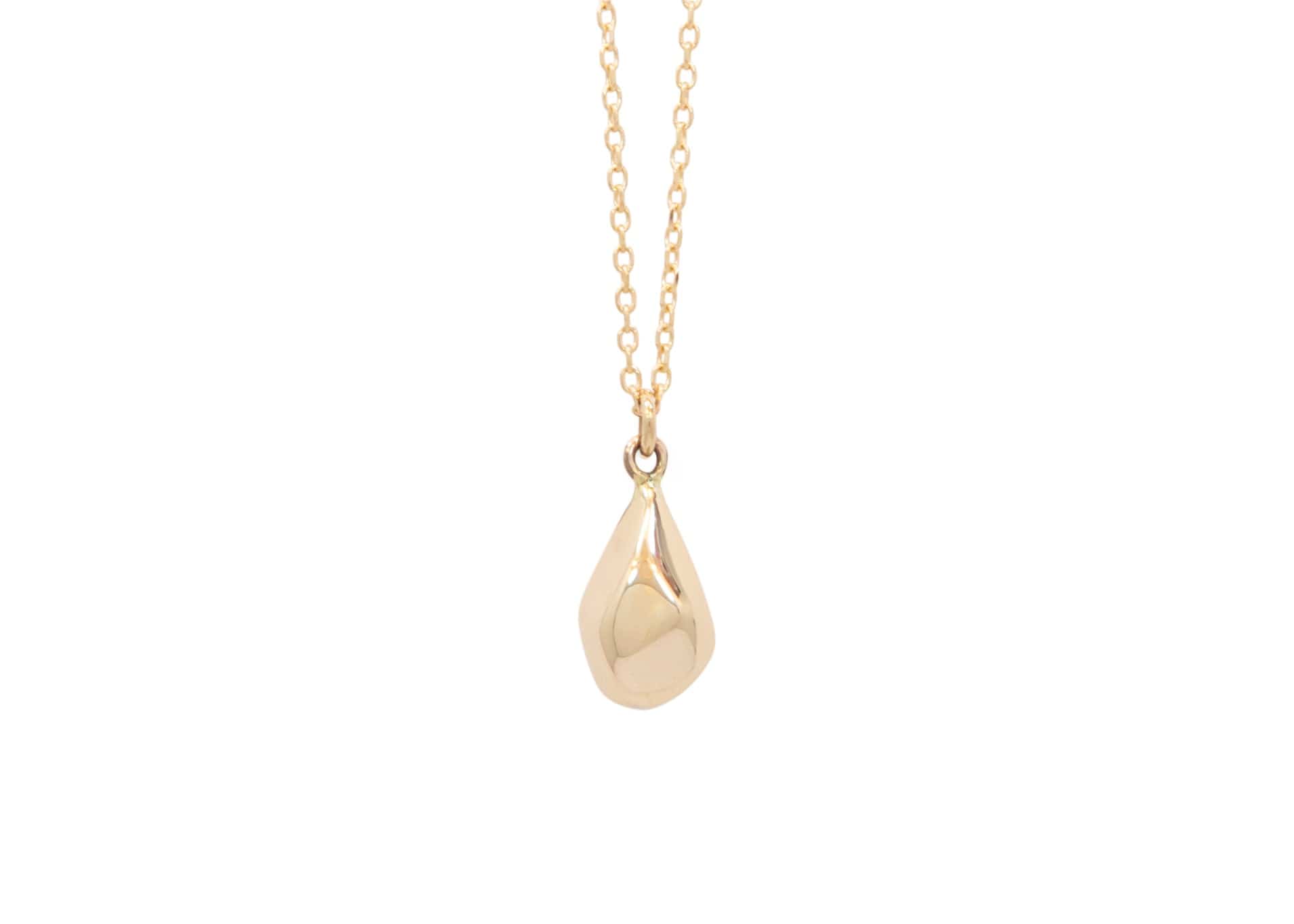 faceted gold teardrop shaped pendant on chain