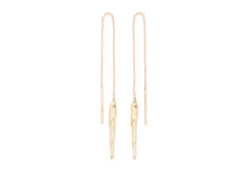 gold chain threader earrings with long thin twisted shell spine dangle