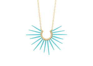 sea urchin inspired necklace with gold chain and blue powder coated spikes