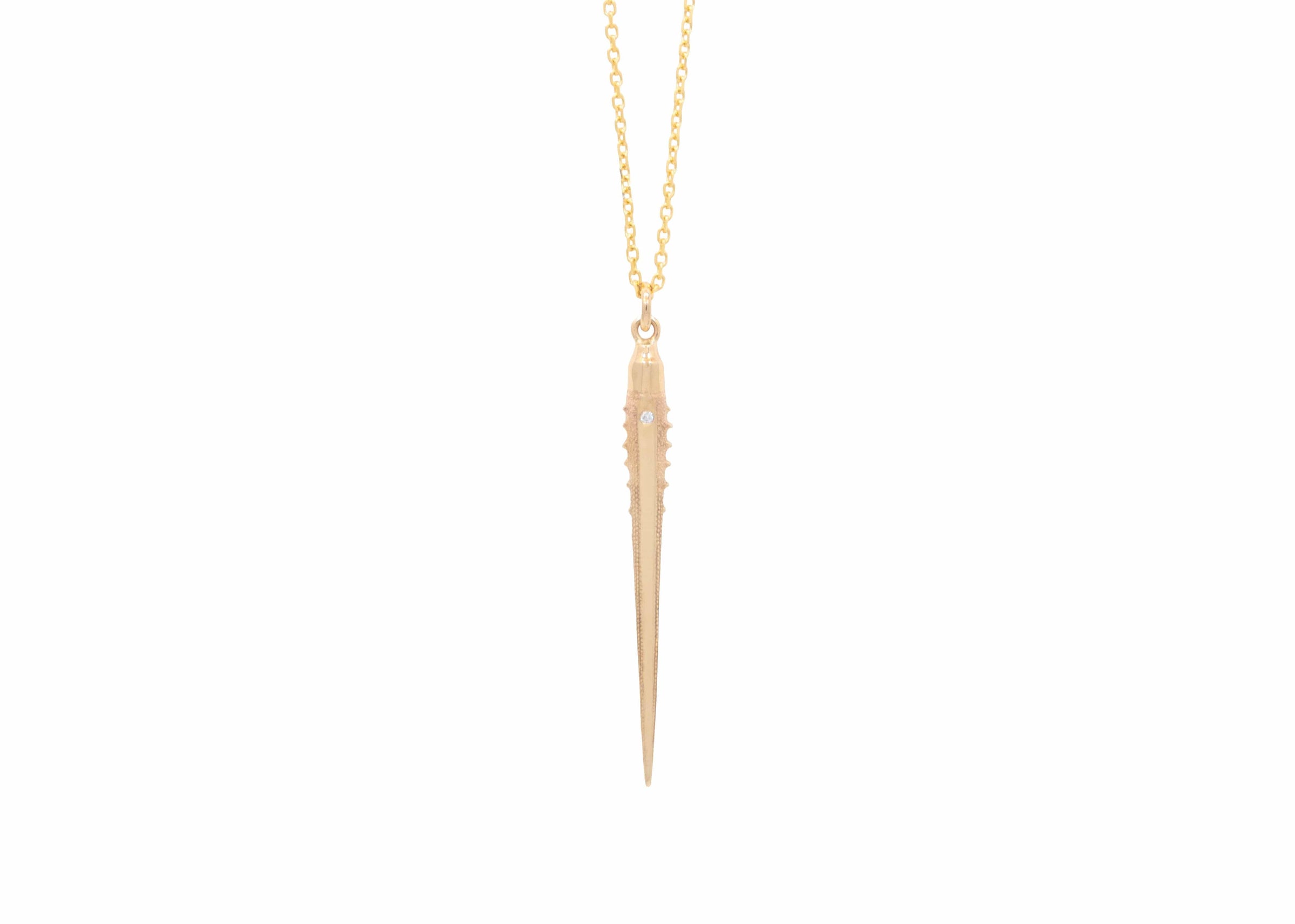 large solid gold urchin spine necklace with single diamond