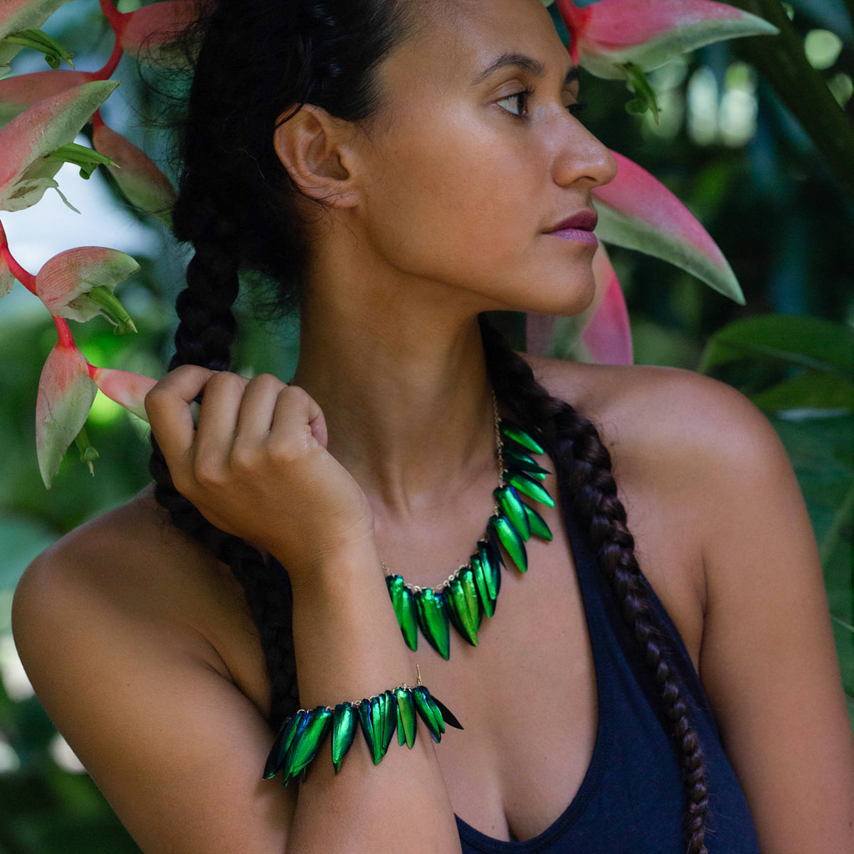 rava-ray-modeling-beetle-wing-jewelry-in-moorea