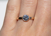 gold wave ring with diamond on hand