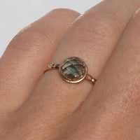 14k gold rose cut teal Montana sapphire ring with claw setting on hand