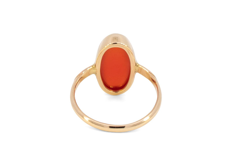 back of 14k gold ring with oblong carnelian in notched bezel setting