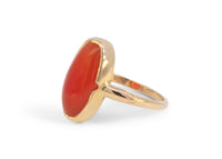 side of 14k gold ring with oblong carnelian in notched bezel setting