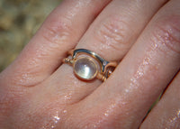 14k gold green moonstone ring on hand 