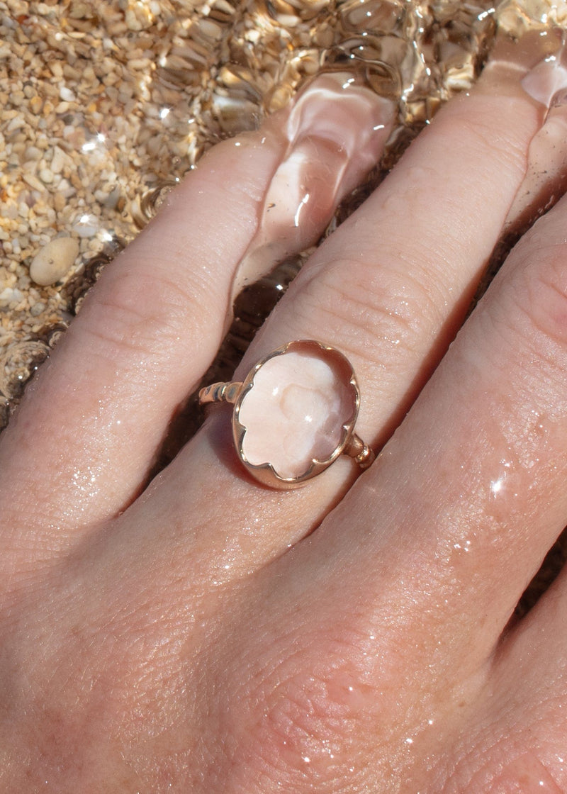 14k gold clear quartz crystal ring on hand in water