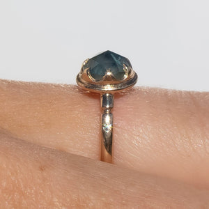 profile of 14k gold rose cut teal Montana sapphire ring with claw setting on hand