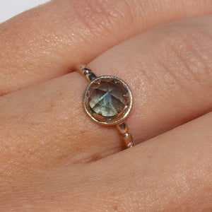 14k gold rose cut teal Montana sapphire ring with claw setting on hand