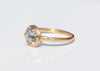 side view of gold alternative engagement ring with claw set rose cut salt and pepper diamond