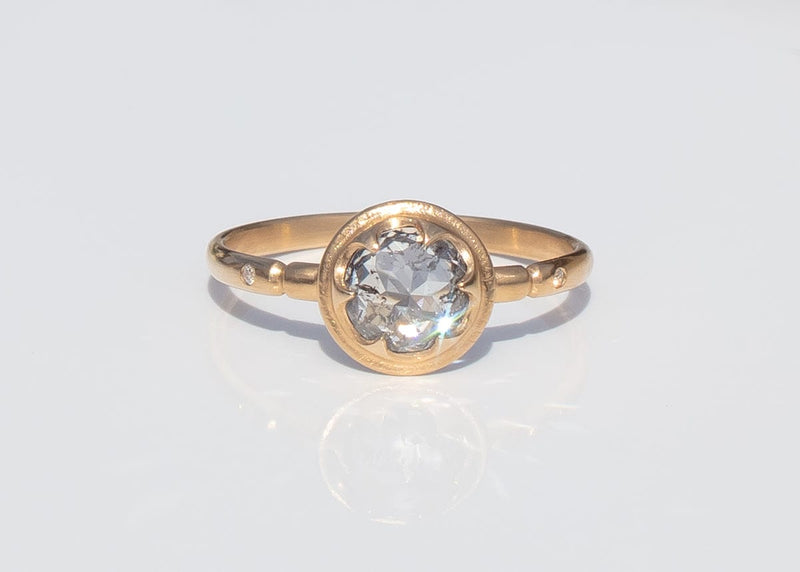 gold alternative engagement ring with claw set rose cut salt and pepper diamond