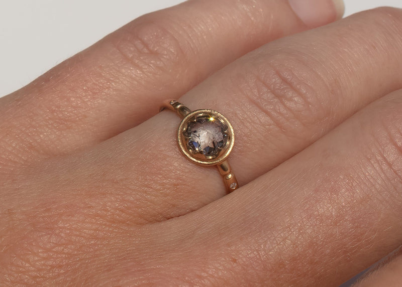 gold alternative engagement ring with claw set rose cut salt and pepper diamond on hand