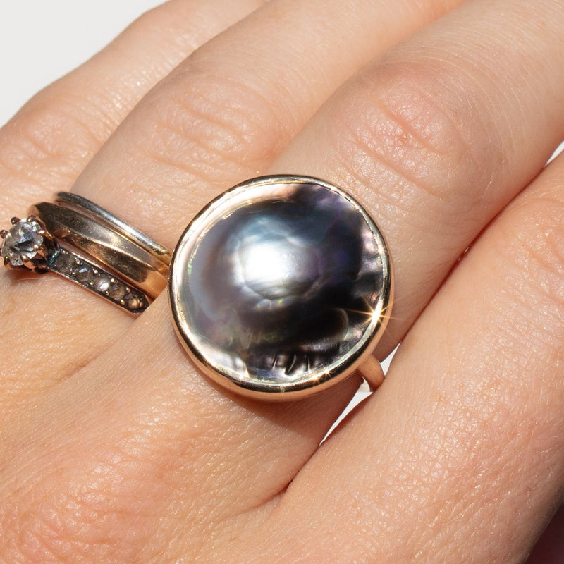 14k gold bicolor tahitian mabe pearl ring on hand