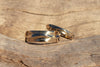 14k gold alternative wave wedding band set on driftwood