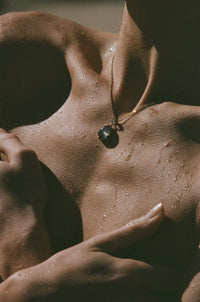 green moonstone necklace on model in sun
