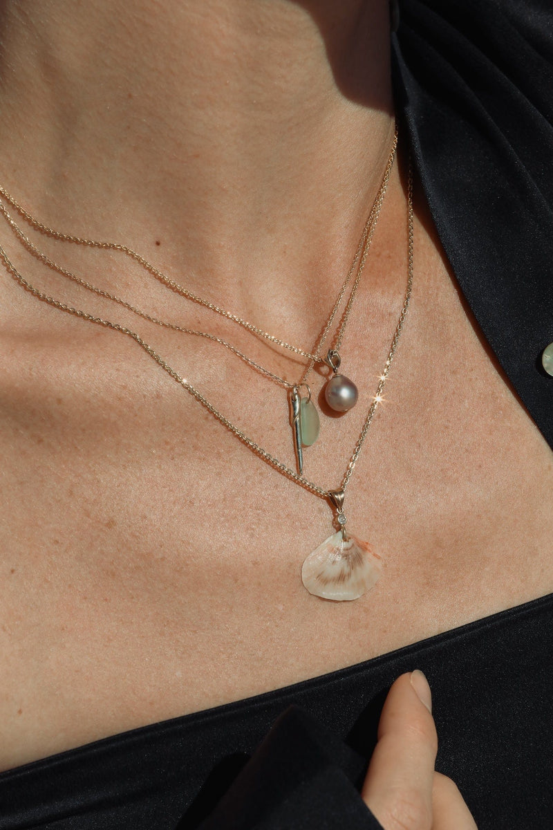 layered ocean shell and pearl necklaces