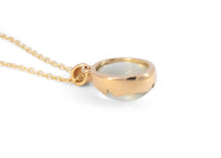 back of 14k gold green moonstone necklace with scalloped bezel