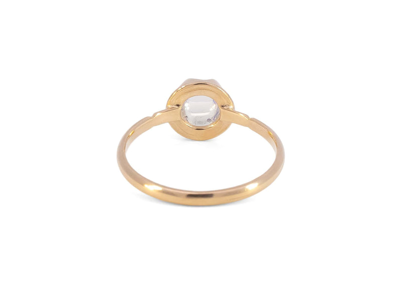 back of gold blue moonstone ring in scalloped setting