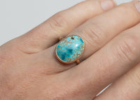 14k gold bezel set iron maiden turquoise ring on hand