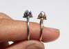 antique inspired rings with bullet shaped blue moonstones in scalloped setting on hand