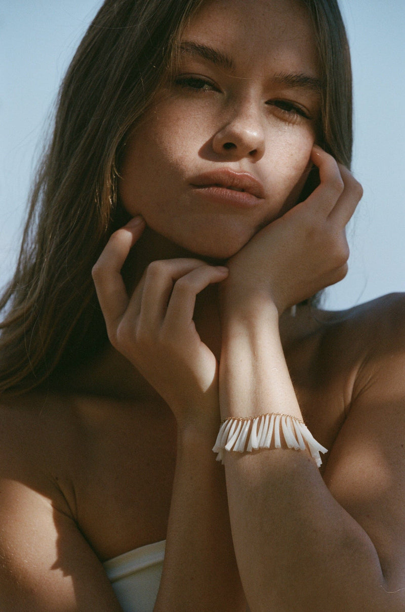 shell jewelry on model in hawaii