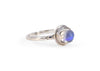 side of silver antique inspired ring with blue moonstone in scalloped setting