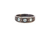 oxidized sterling silver urchin shell inspired ring with inverted blue zircon stones
