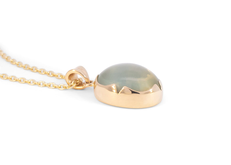 side of 14k gold green moonstone necklace with scalloped bezel