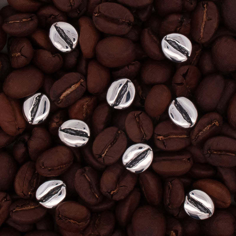 sterling silver coffee bean stud earrings on coffee beans