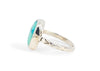 side view of sterling silver egyptian turquoise ring with oxidized details and diamond