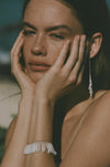 white dentalium tusk shell earrings and bracelet on model