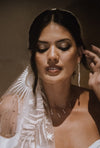 white dangly stick pearl cascade earrings on bride