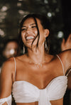 white stick pearl cascade earrings on bride