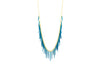 sea urchin inspired fringe necklace with gold chain and powder coated blue spikes 