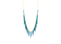 sea urchin inspired fringe necklace with gold chain and powder coated blue spikes 