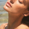 14k gold and diamond ear cuff on model