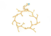 gold seaweed link bracelet with blue gemstone