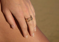 14k gold rockweed seaweed rings on hand