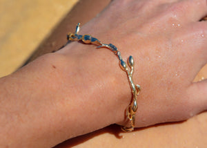 gold rockweed seaweed bracelet on hand