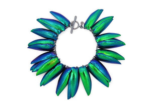 iridescent blue and green scarab beetle wing bracelet on black chain with toggle clasp