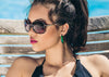 iridescent green scarab beetle wing earrings on model