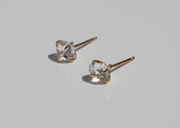 14k gold claw set clear Herkimer diamond stud earrings with sun shining through