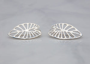 sterling silver taro kalo leaf earrings on gray tile