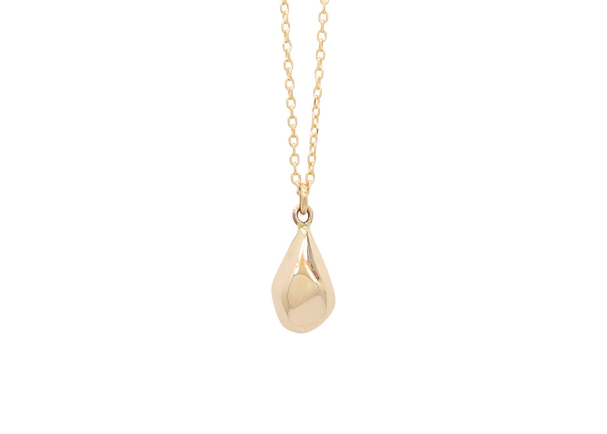 faceted gold teardrop shaped pendant on chain