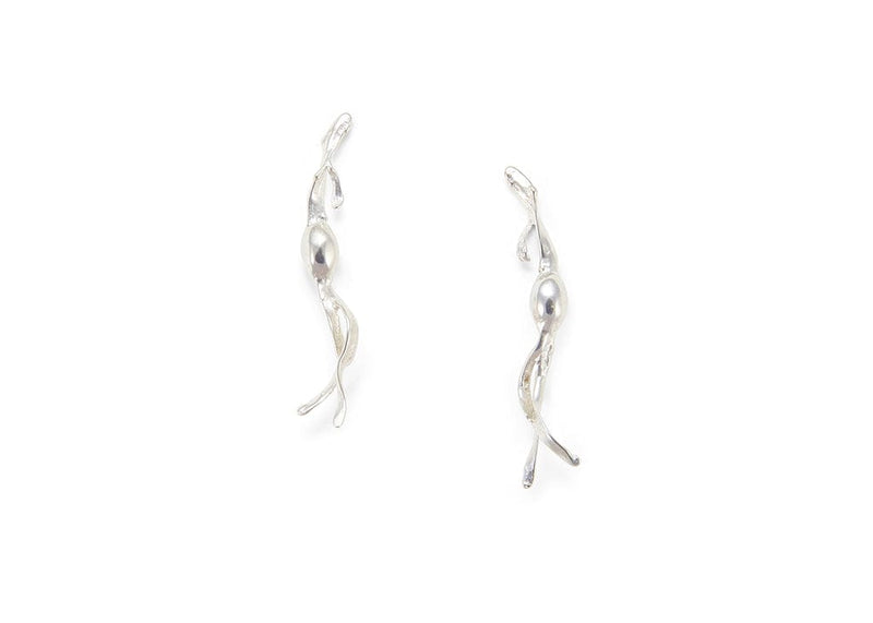 cast sterling silver seaweed earrings on model